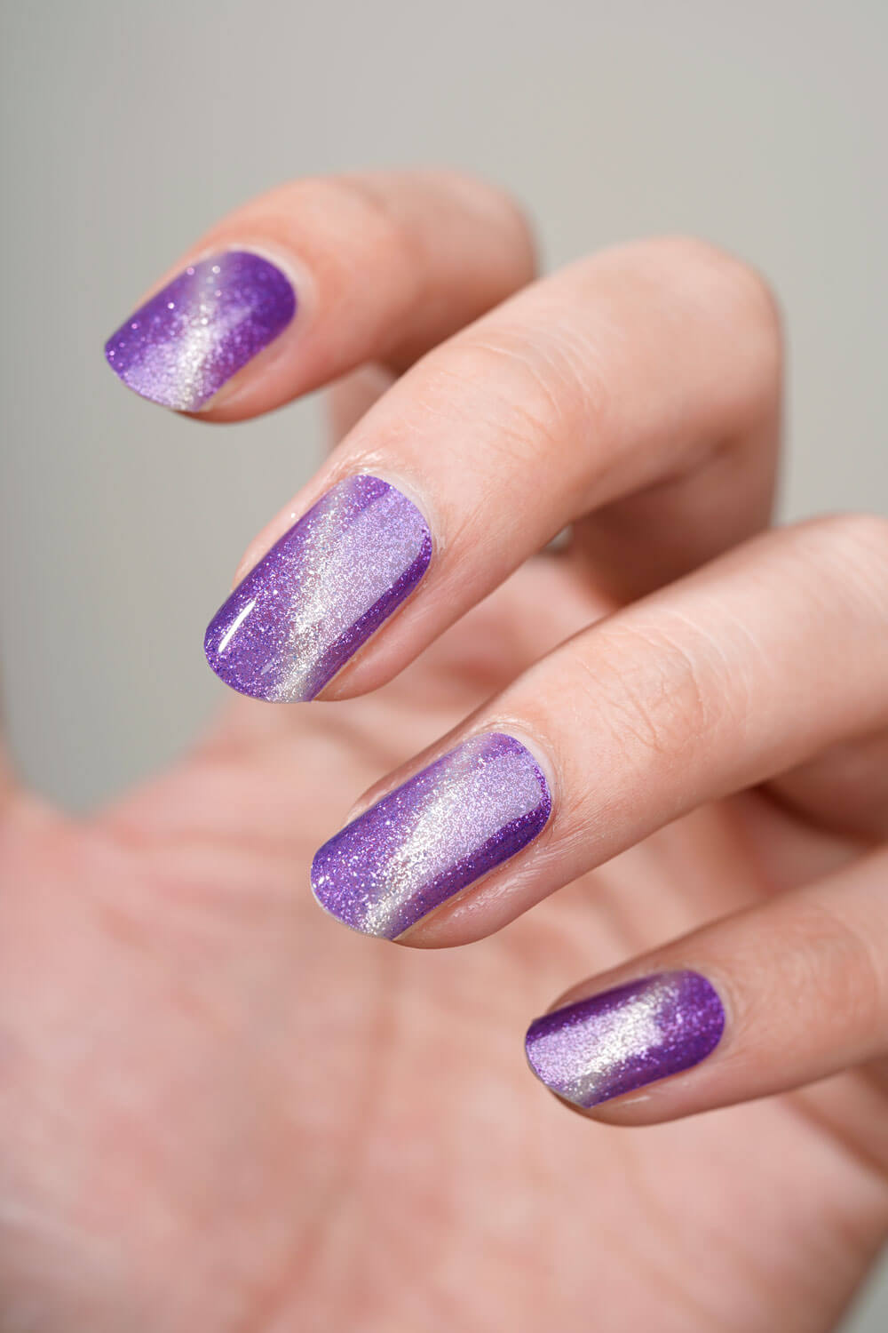 Mẫu nail mắt mèo màu tím thuỷ chung