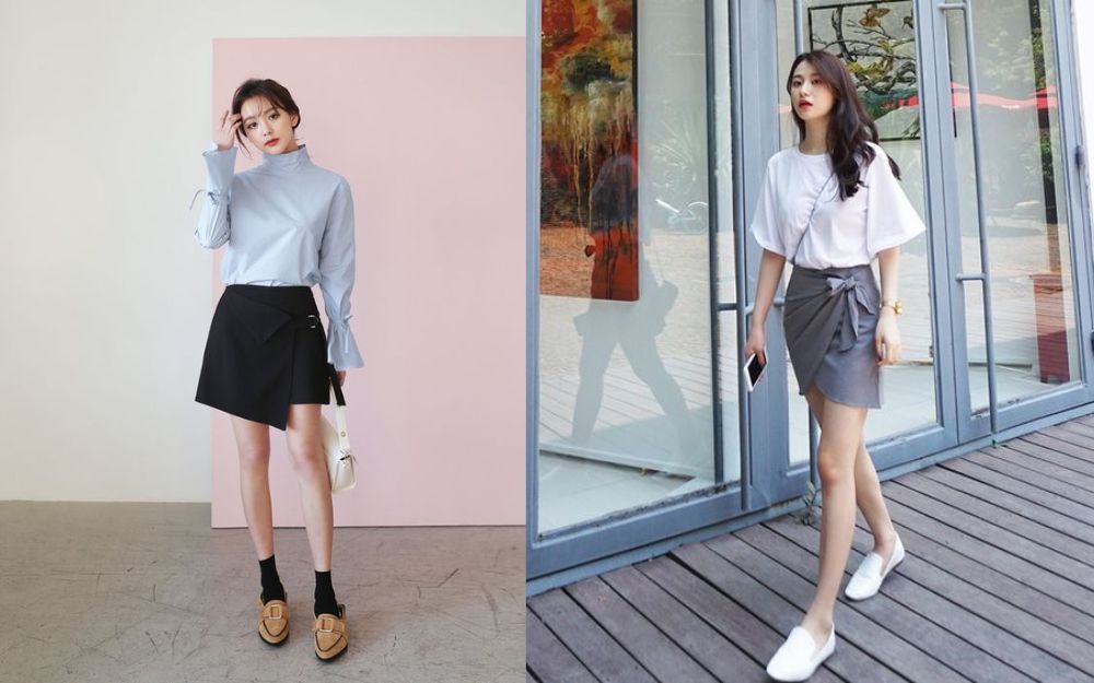 Chân váy đen sì vạt chéo cánh kết phù hợp với áo blouse
