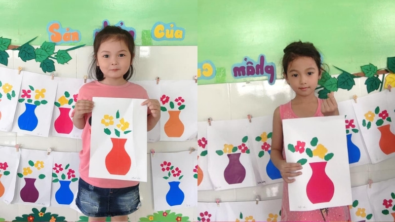 Cắt dán giấy màu thành hoa đào, hoa mai để tạo nên bức tranh Tết rực rỡ, sống động